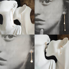Charger l&#39;image dans la galerie, Boucles d’oreilles longues en perles et chaîne dorée, style minimaliste avec une touche de luxe discret.
