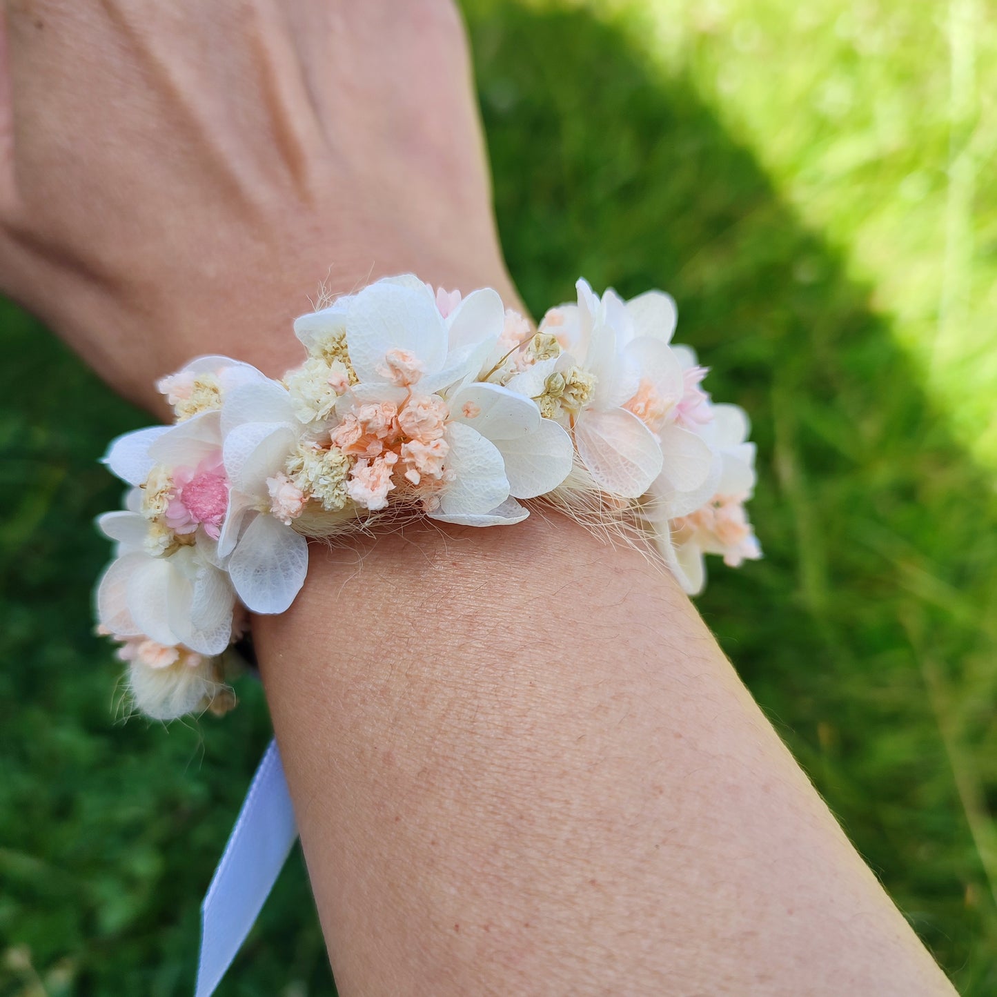 Victoire Bracelet with Dried and Preserved Flowers Worn by an Adult - Bracelet fitting on an adult’s wrist